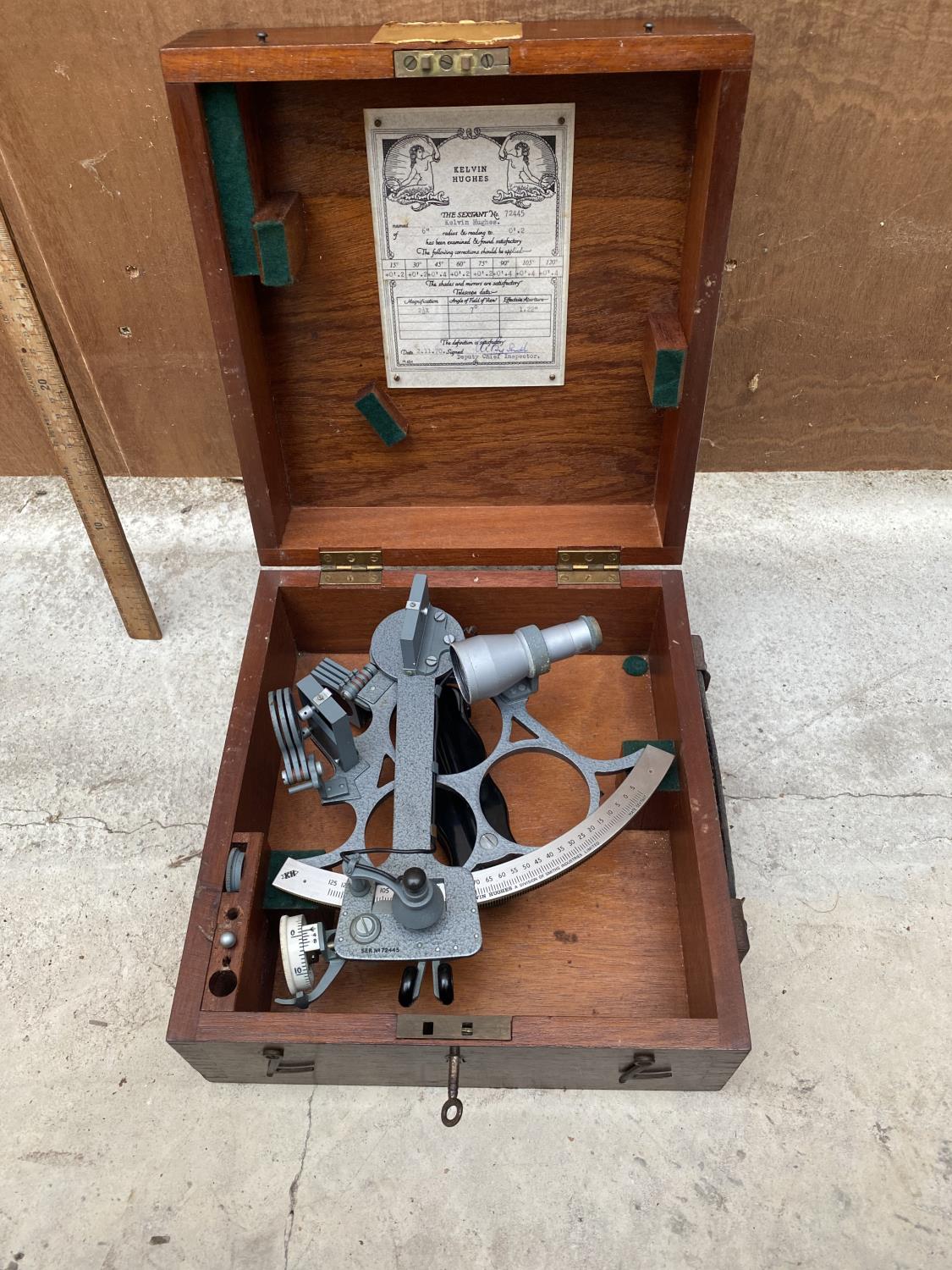 A VINTAGE KELVIN HUGHES MARITIME SEXTANT IN A LOCKABLE MAHOGANY CASE WITH KEY