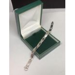 A HEAVY SILVER BRACELET MARKED 925 LENGTH APPROXIMATELY 19CM WITH PRESENTATION BOX