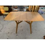 A RETRO TEAK DROP LEAF DINING TABLE