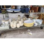 A LARGE QUANTITY OF CERAMIC KITCHEN WARE TO INCLUDE FLAN DISHES ETC