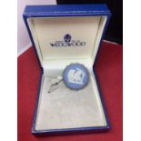 A BOXED WEDGEWOOD BLUE AND WHITE JASPERWARE BROOCH