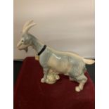 A SPANISH POTTERY FIGURE OF A GOAT
