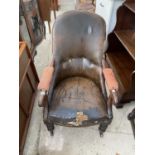 A 19TH CENTURY MAHOGANY FRAMED BUTTON-BACK FIRESIDE CHAIR