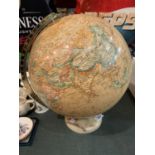 A WORLD GLOBE WITH AN INTERNAL LIGHT BELIEVED IN WORKING ORDER BUT NO WARRANTY