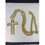 A LONG HEAVY YELLOW METAL CHAIN AND A LARGE CROSS WITH CLEAR STONES