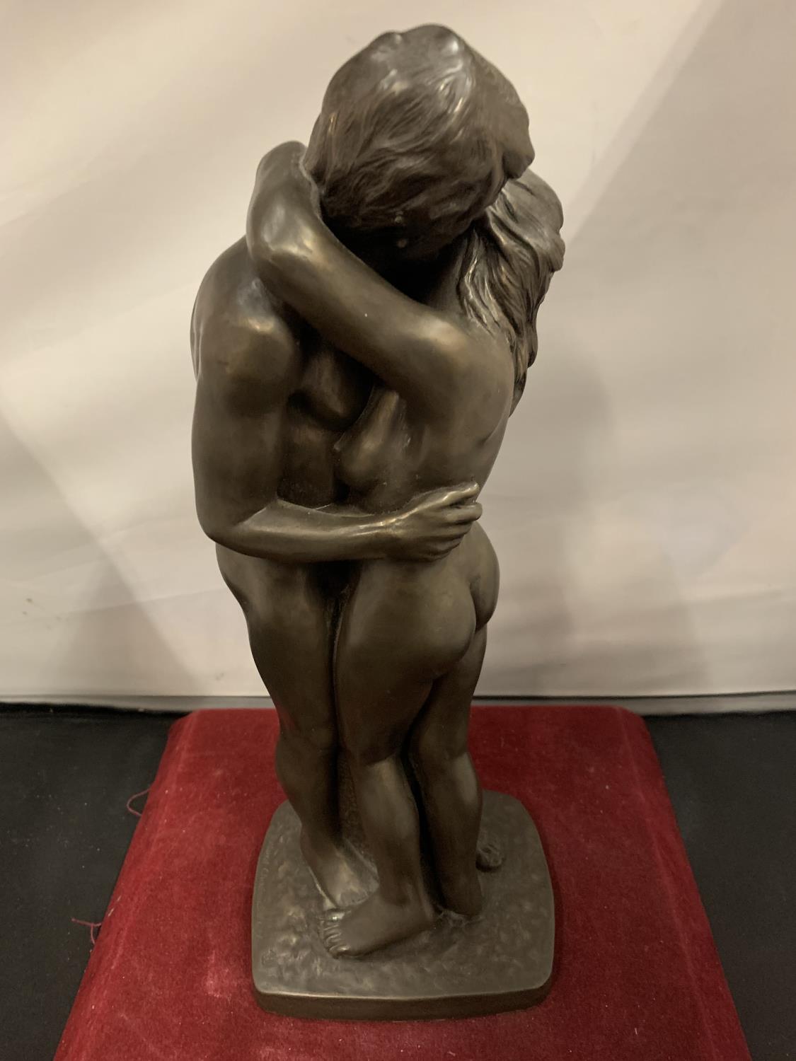 TWO SPELTER NUDES IN AN EMBRACE