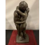 TWO SPELTER NUDES IN AN EMBRACE