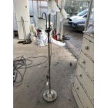 A BRONZE EFFECT THREE ARM FLOOR LAMP WITH GLASS PETAL SHADES