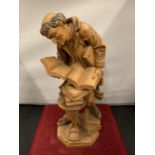 A CARVED WOODEN FIGURINE OF AN HISTORICAL SCHOLAR