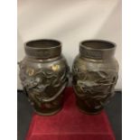 A PAIR OF ORIENTAL STYLE BRONZE VASES WITH DRAGON DESIGN