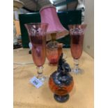 A GROUP OF CRANBERRY GLASS ITEMS TO INCLUDE A PAIR OF CHAMPAGNE GLASSES