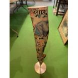 A STYLISED DECOUPAGED LEG ON A CHROME BASE