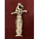 A DECORATIVE DUTCH SILVER CORKSCREW DEPICTING A BOY WITH A GOBLET