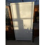 A WHITE TWO DOOR WARDROBE