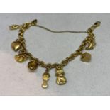 AN 18 CARAT GOLD CHARM BRACELET WITH EIGHT VARIOUS 18 CARAT GOLD CHARMS WEIGHT 18.8g