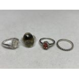 FOUR ASSORTED SILVER RINGS WITH VARIOUS STONES