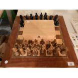 A WOODEN CHESS SET WITH CHARACTER FIGURES