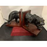A PAIR OF VINTAGE BOOK ENDS IN THE GUISE OF A BLACK JAGUAR