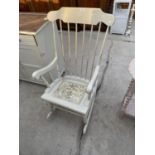 A SHABBY CHIC ROCKING CHAIR WITH UNICORN DECORATION