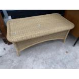 A MODERN WICKER COFFEE TABLE