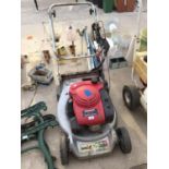 A HONDA PETRO LAWN MOWER WITHOUT GRASS BOX