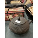 A CAST IRON FIRESIDE KETTLE