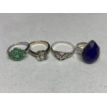 FOUR ASSORTED SILVER RINGS TO INCLUDE GREEN, CLEAR AND BLUE STONE EXAMPLES