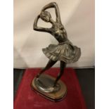 A SPELTER BALLET DANCER FIGURINE ON A WOODEN PLINTH