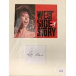 A MOUNTED COLOUR PHOTOGRAPH OF RITA MORENO AND HER AUTOGRAPH