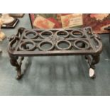 A CAST IRON TRIVET