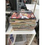 A LARGE QUANTITY OF VINYL RECORD ALBUMS TO INCLUDE QUEEN, JOHN LENNON, THE BEATLES, THOMPSON TWINS