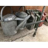 TWO VINTAGE GALVANISED WATERING CANS