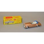 A boxed Dinky Toys 194 Bentley Coupe with metalllic bronze finish, cream interior and blue hood,
