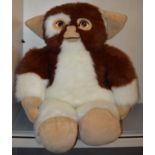 A very large Gizmo soft toy from Gremlins which measures approximately 41 inches tall and 28