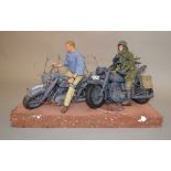A 1:6 scale diorama representing Steve McQueen in 'The Great Escape', the base of which is