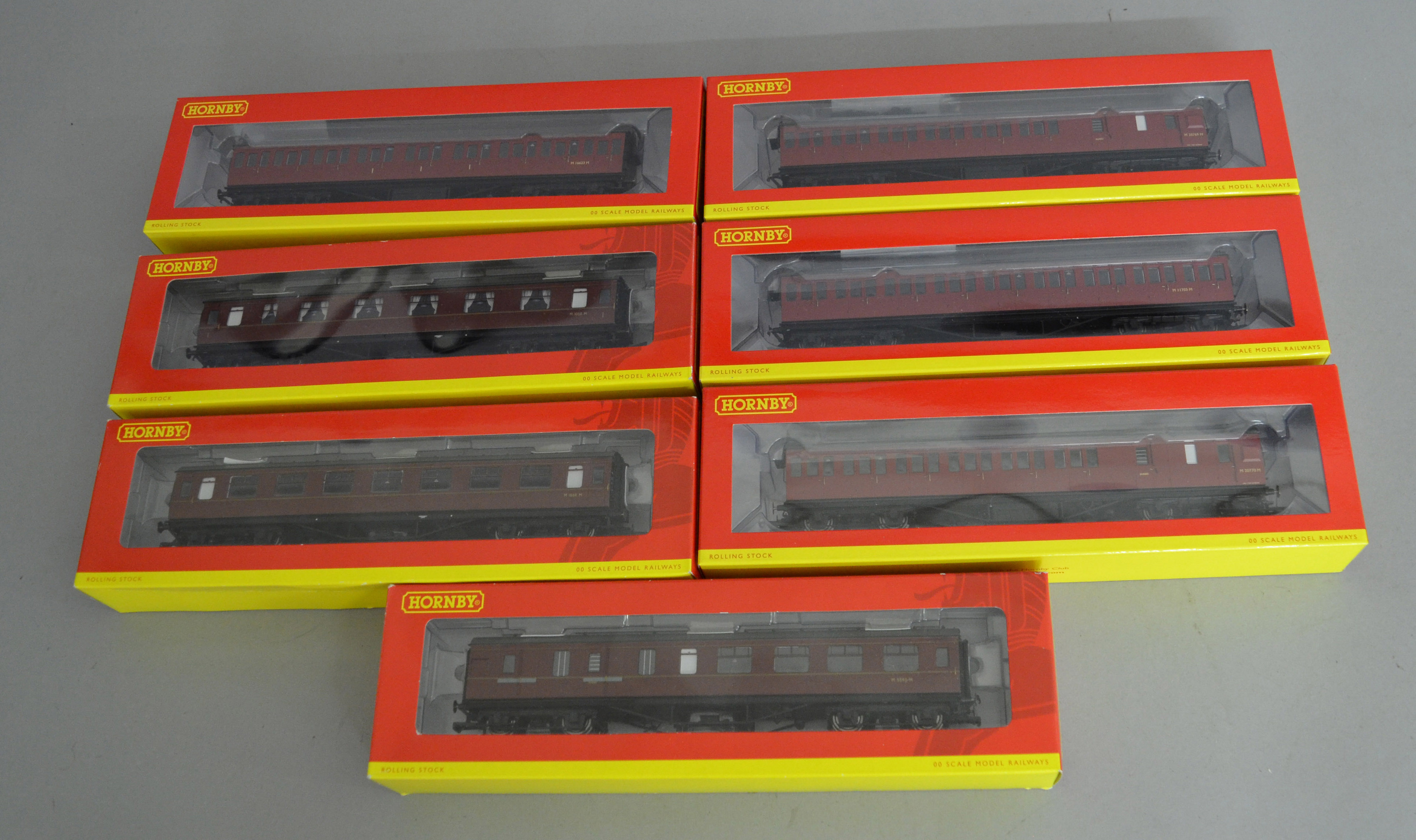 OO Gauge. 7 boxed Hornby BR maroon (ex LMS) Coaches including three lined Period 3 Corridor Coaches,