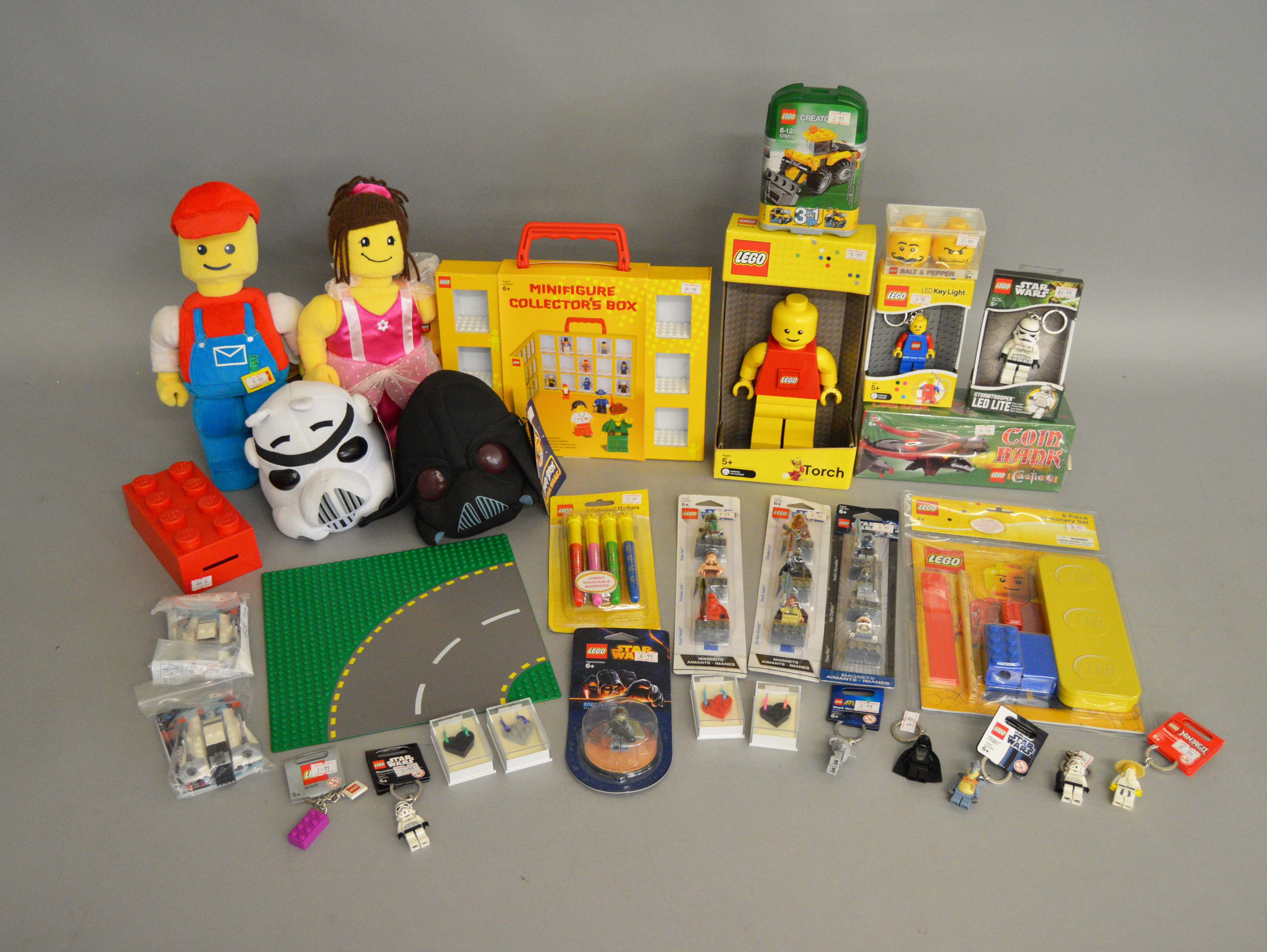 A collection of Lego items which includes; soft toys, keyrings, torch etc.