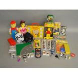 A collection of Lego items which includes; soft toys, keyrings, torch etc.