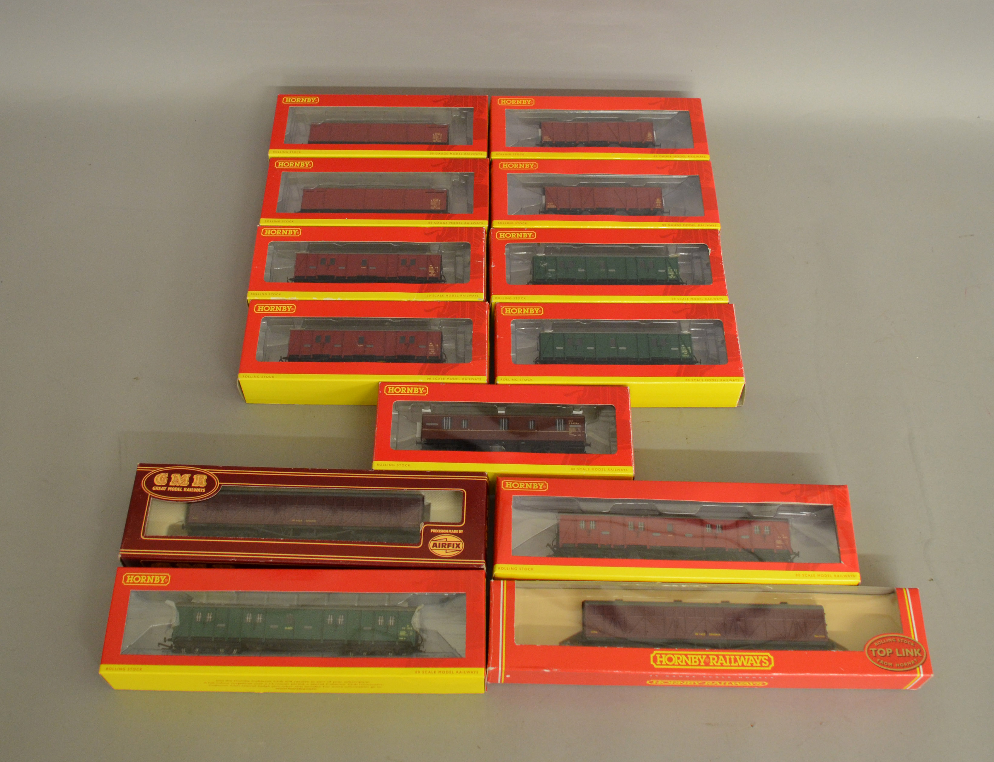 OO Gauge. 12 individually boxed items of Hornby Rolling Stock including Parcels, Passenger Brake and