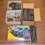 A boxed Scalextric 'Speed Machines X1' Set together with a box of loose parts - barriers, throttles,