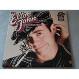 Elton John signed double gatefold LP signed by the musician himself in black marker pen. (1)