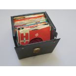 Record box of 7 inch singles including George Harrison, The Beatles, The Rolling Stones, Ken Boothe,