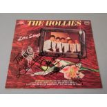 The Hollies signed LP Love Songs signed to cover in black pen by Eric Haydock, Tony Hicks, Bobby