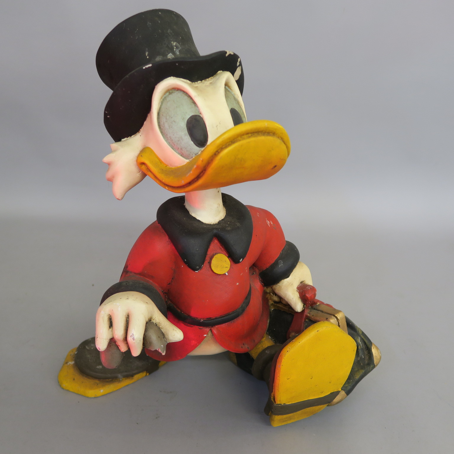 Walt Disney Scrooge McDuck statue ex shop display with cane missing measuring 21 inches tall. Disney