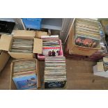 Collection of 5 boxes of vinyl LP records from a closed record shop including second hand and 12"