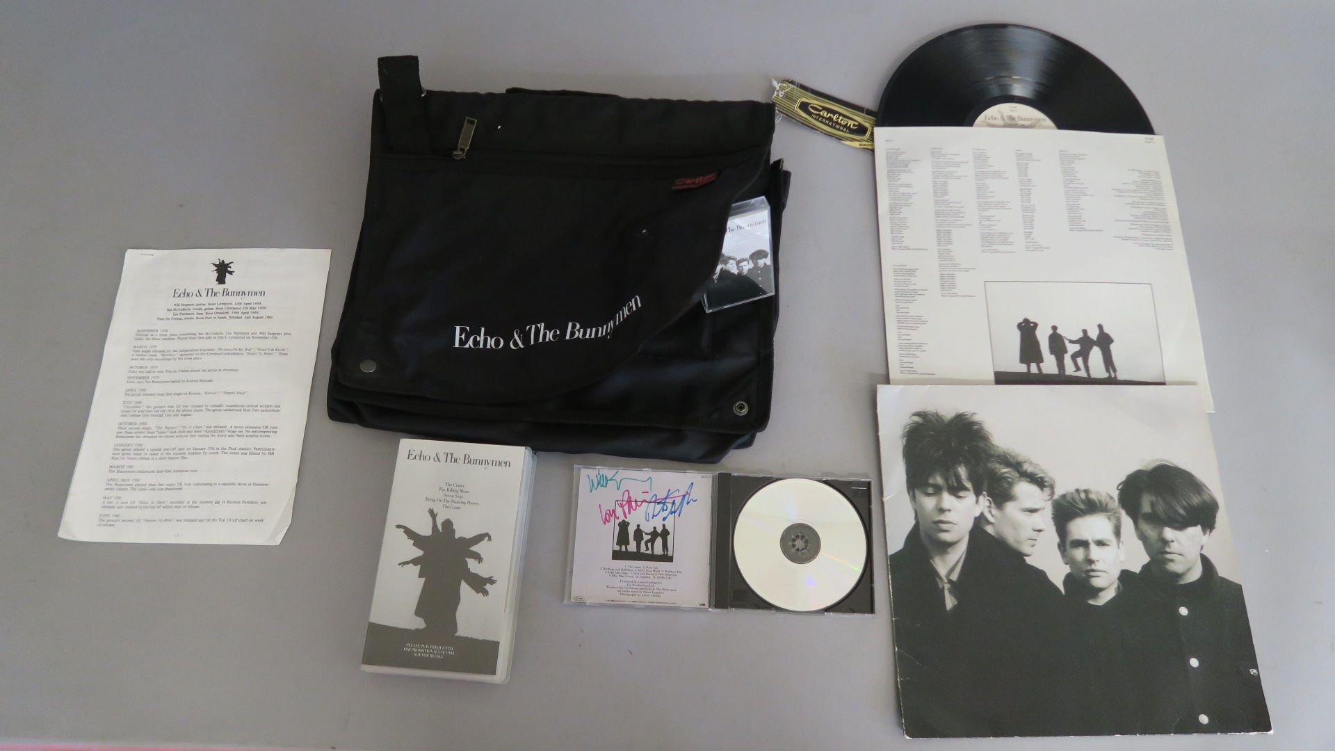 Echo & the Bunnymen Carlton International luggage bag promotional item including LP WX 108, cassette