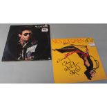 Nils Lofgren 2 signed LPs signed to cover in black pen. (2) Provenance - This signature was obtained