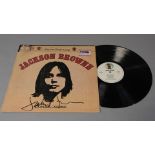 Jackson Browne signed LP "Saturate Before Using" SYL 9002 signed by the artist to cover in black