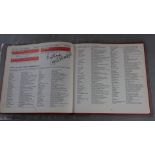 The 1977 Guinness Book of UK singles complete with 250 signatures from pop artists each obtained