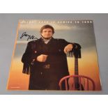 Johnny Cash signed Is Coming to Town LP vinyl record MERH 108 signed "Johnny Cash" in black pen to